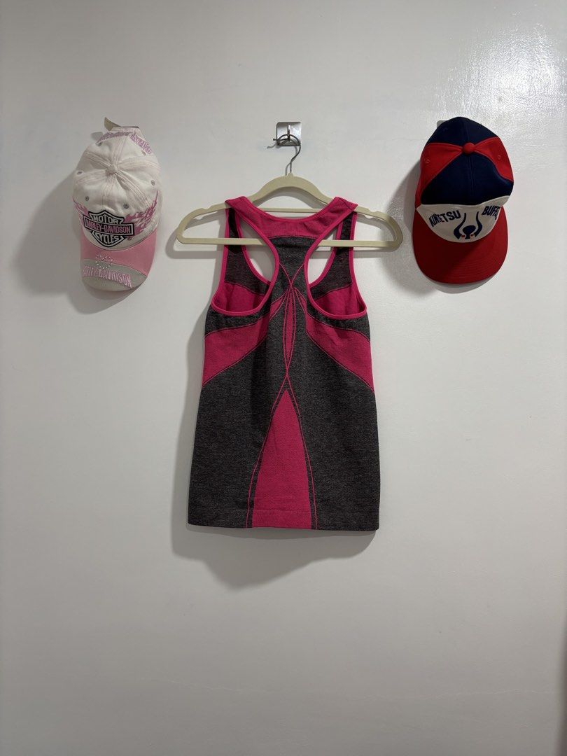 Xersion Athletic Tank Top Grey Pink Size M (Category: Activewear) located in Calbayog City. Submitted by zaxcheus_castillo1708 (Listing ID 1469673944, Image 2). Description: - Brand: Xersion - Size: M - Color: Grey with bright pink contrast panels - Material: 96% polyester, 4% spandex - Style: Racerback activewear tank top - Ideal for: Gym workouts, running, and sports.