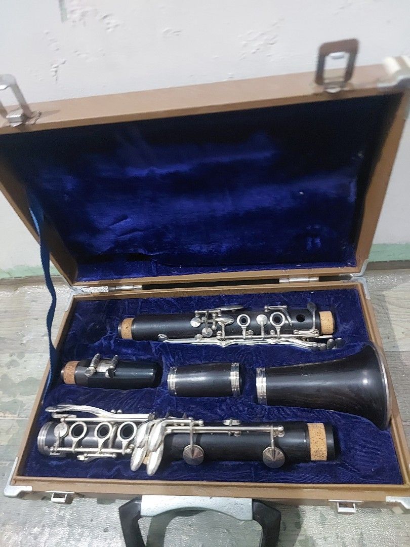 Yamaha Japan Clarinet in Hard Case (Category: Musical Instruments) located in Quezon City. Submitted by jpnvintageonline (Listing ID 1469689502, Image 1). Description: Yamaha Japan clarinet disassembled inside original brown hard case. Blue velvet interior lining. Includes mouthpiece, barrel, upper joint, lower joint, and bell with silver-plated keys. Wooden or resin body construction. Case exterior has Yamaha logo badge on top. Latches and handl