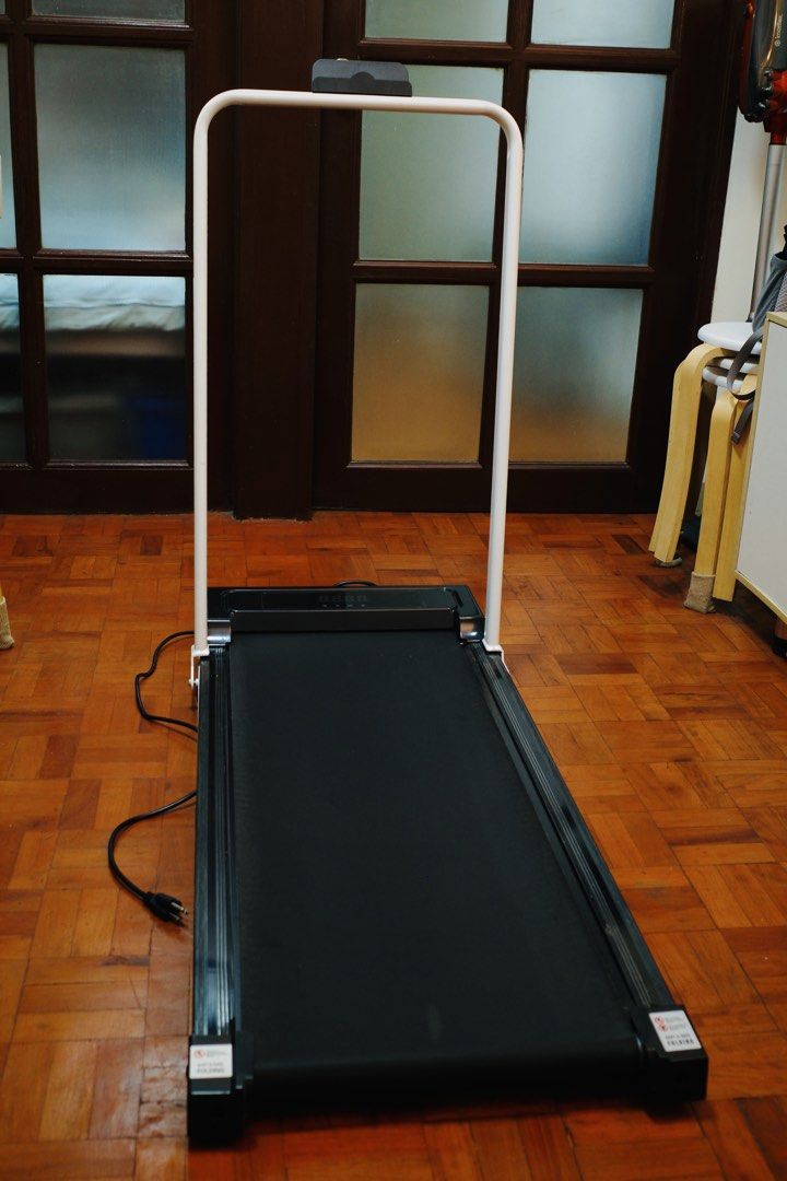 YEESALL Electric Treadmill 3.5HP with Remote Control (Category: Cardio & Fitness Machines) located in Mandaluyong City. Submitted by MarilynsMole (Listing ID 1469614583, Image 2). Description: YEESALL 3.5HP electric treadmill. Folds flat with a white upright handle frame. LED display screen on the base. Includes wireless remote control to adjust speed and settings. Heavy duty black walking belt. Compact size for home workouts. Plug in power cord 