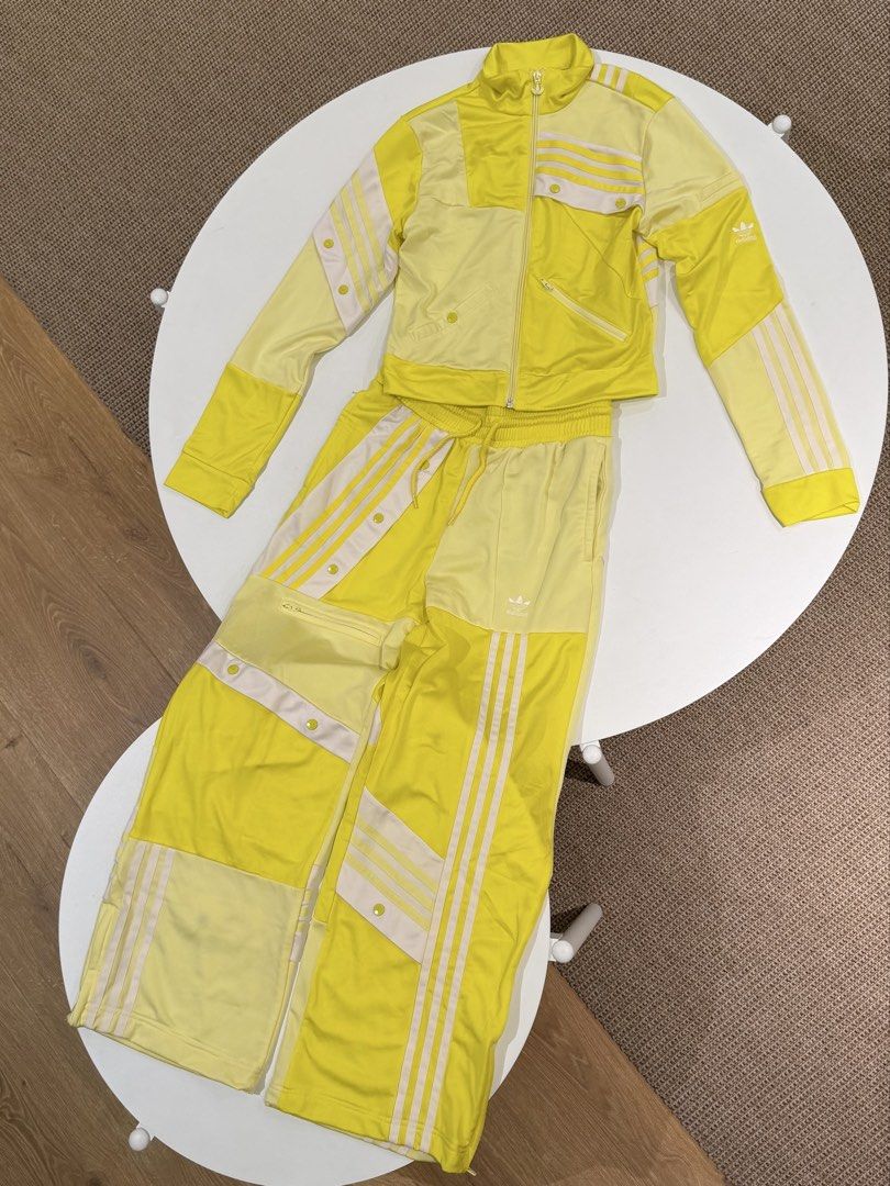 Yellow Adidas Orginals X Danielle Cathari (Category: Activewear) located in Muntinlupa City. Submitted by henlo03 (Listing ID 1469584612, Image 2). Description: - Brand: Adidas - Item: Matching tracksuit set (zip-up jacket and drawstring pants with pockets) - Color & Design: Bright yellow with unique patchwork and classic three stripes - Details: Snap button accents, bold statement streetwear piece - Material: Extremely comfortable - Size: UK 8, 