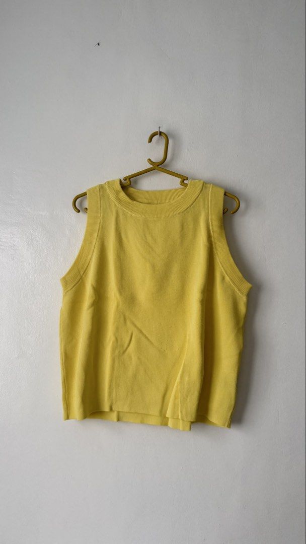 Yellow Knit Tank Top Sleeveless Crewneck Pullover (Category: Sleeveless) located in Cainta. Submitted by getsometin (Listing ID 1469663998, Image 1). Description: - Color: Bright yellow - Style: Sleeveless knit tank top with crew neckline - Details: Ribbed trim at collar and armholes, soft and stretchy fabric - Fit: Easy to pair with high-waisted denim, skirts, or shorts - Condition: Brand new / Excellent (Ready to wear).