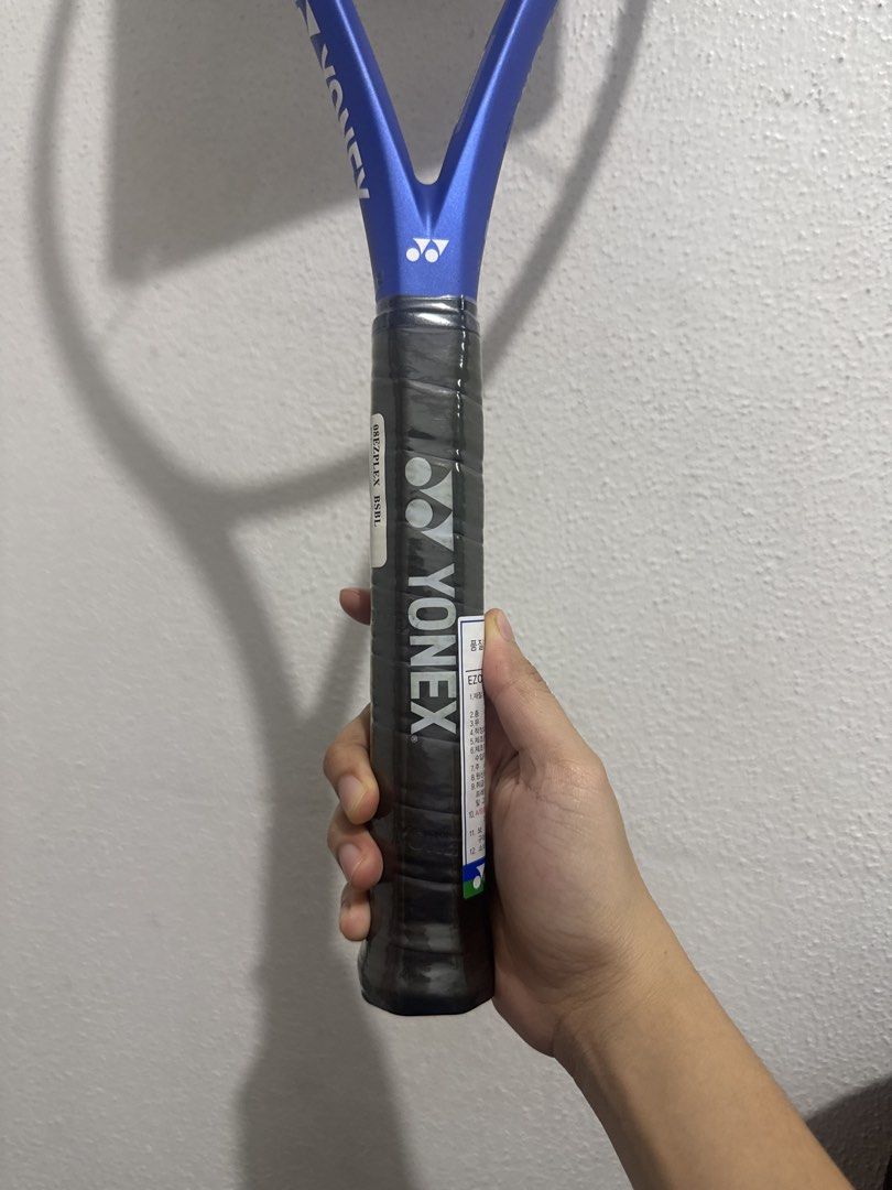 Yonex Ezone Play Tennis Racket (Category: Racket and Ball Sports) located in Marikina City. Submitted by ellapam (Listing ID 1469716622, Image 3). Description: - Item: Yonex Ezone Play Tennis Racket - Color: Blue - Condition: Brand new with original tags attached and grip still wrapped in plastic - Head Size: 100 sq. in. - Weight: 265g / 9.3 oz. - Balance: 335mm - Length: 27 inches - String Pattern: 16 x 19 - Ideal for players looking for a light
