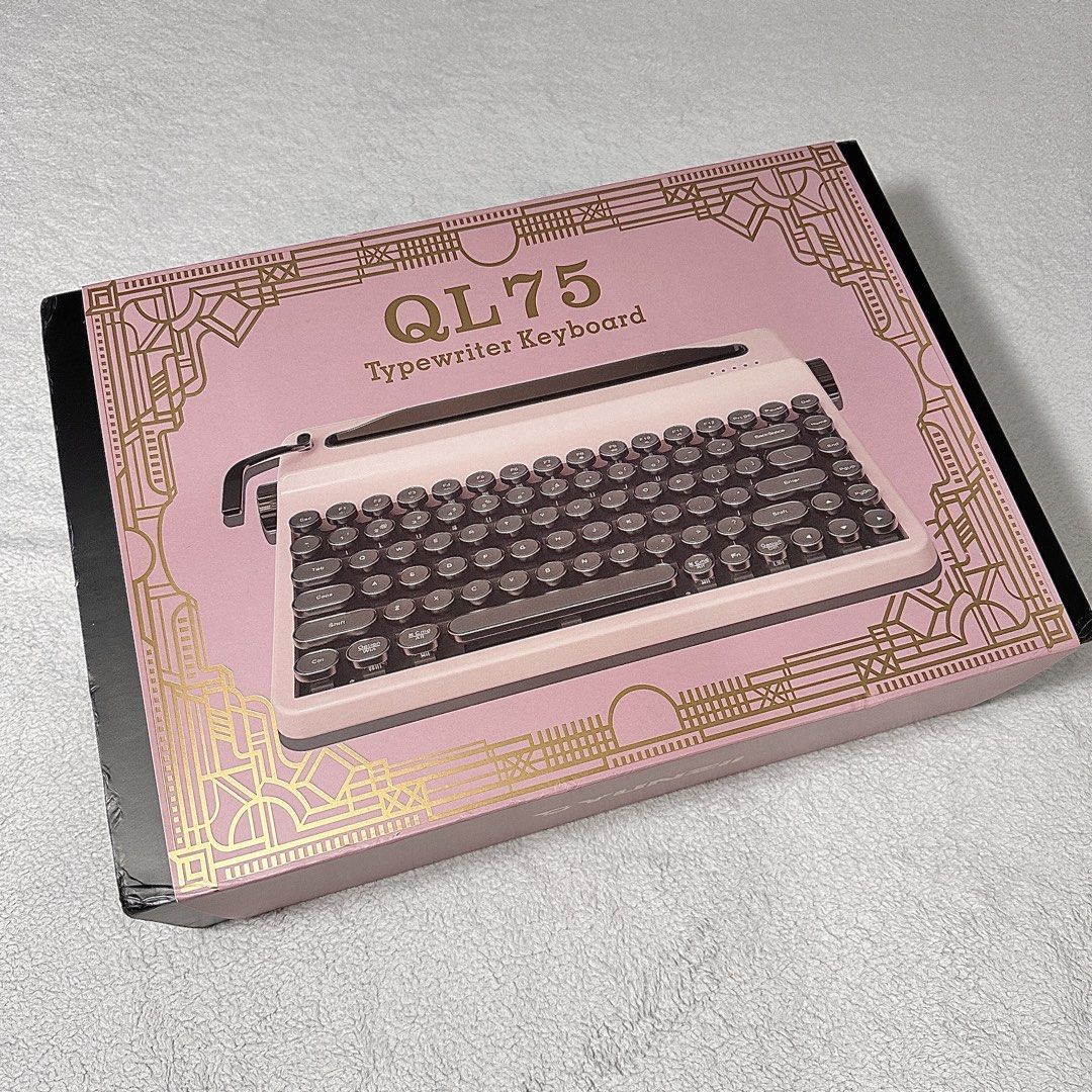 YUNZII QL75 Typewriter Keyboard in Pink (Category: Computer Keyboard) located in Paranaque City. Submitted by hershey_august (Listing ID 1469679708, Image 3). Description: - Model: YUNZII QL75 Mechanical Keyboard - Color: Pink - Design: Vintage typewriter style with circular keycaps and a functional metal pull bar - Layout: Compact 75 percent - Connectivity: Wireless with multi-device Bluetooth indicators - Inclusions: Original box, user manual, 