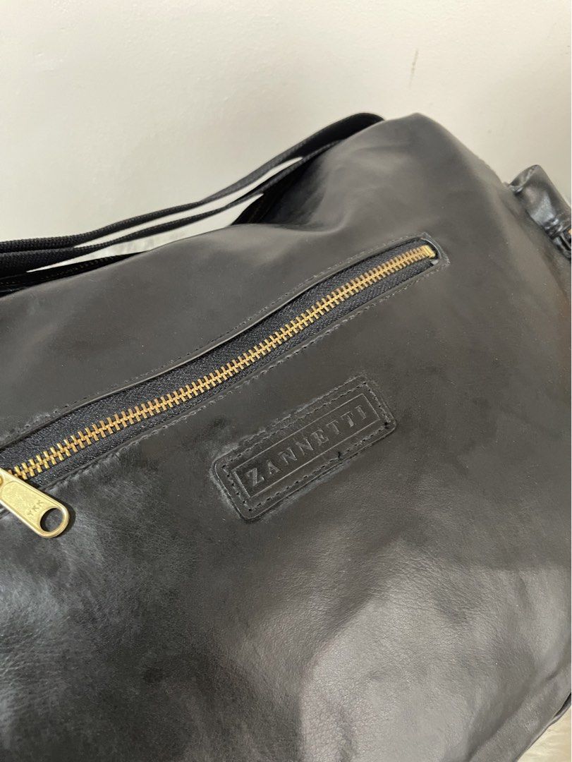 Zannetti Large Multi-Pocket Black Leather Sling Shoulder Bag (Category: Cross-body Bags) located in Teresa. Submitted by savvyonbranded (Listing ID 1469694596, Image 3). Description: 10.5 x 14 x 5 inches .