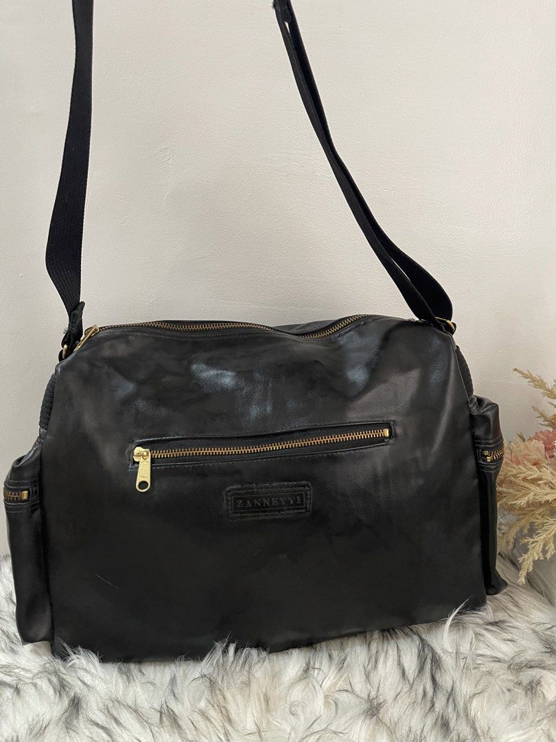 Zannetti Large Multi-Pocket Black Leather Sling Shoulder Bag (Category: Cross-body Bags) located in Teresa. Submitted by savvyonbranded (Listing ID 1469694596, Image 2). Description: 10.5 x 14 x 5 inches .