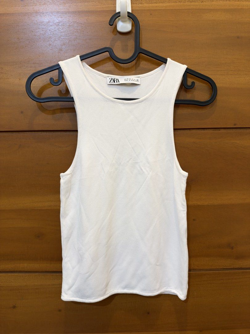 Zara Basic Knit Extra Fine Halter Top in White (Category: Sleeveless) located in Quezon City. Submitted by prebyflo (Listing ID 1469691402, Image 2). Description: Small on tag 9/10 condition Issue: small snag at the back but barely noticeable No other issues.