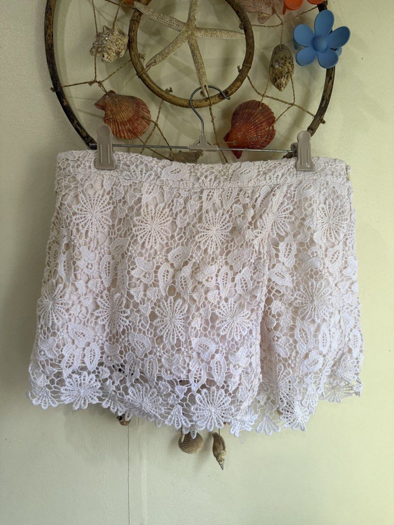 Zara Basic White Lace Shorts Skort Size S (Category: Shorts) located in Cebu City. Submitted by hotchkisscebu (Listing ID 1469613352, Image 1). Description: - Brand: Zara Basic - Size: Small (EUR S, USA S, MEX 26) can fit until semi med - Color: White with cream inner lining - Design: Beautiful floral lace pattern with a front overlay for a skirt effect - Closure: Side zipper - Origin: Made in Turkey - Condition: Clean and ready to wear Overlappi