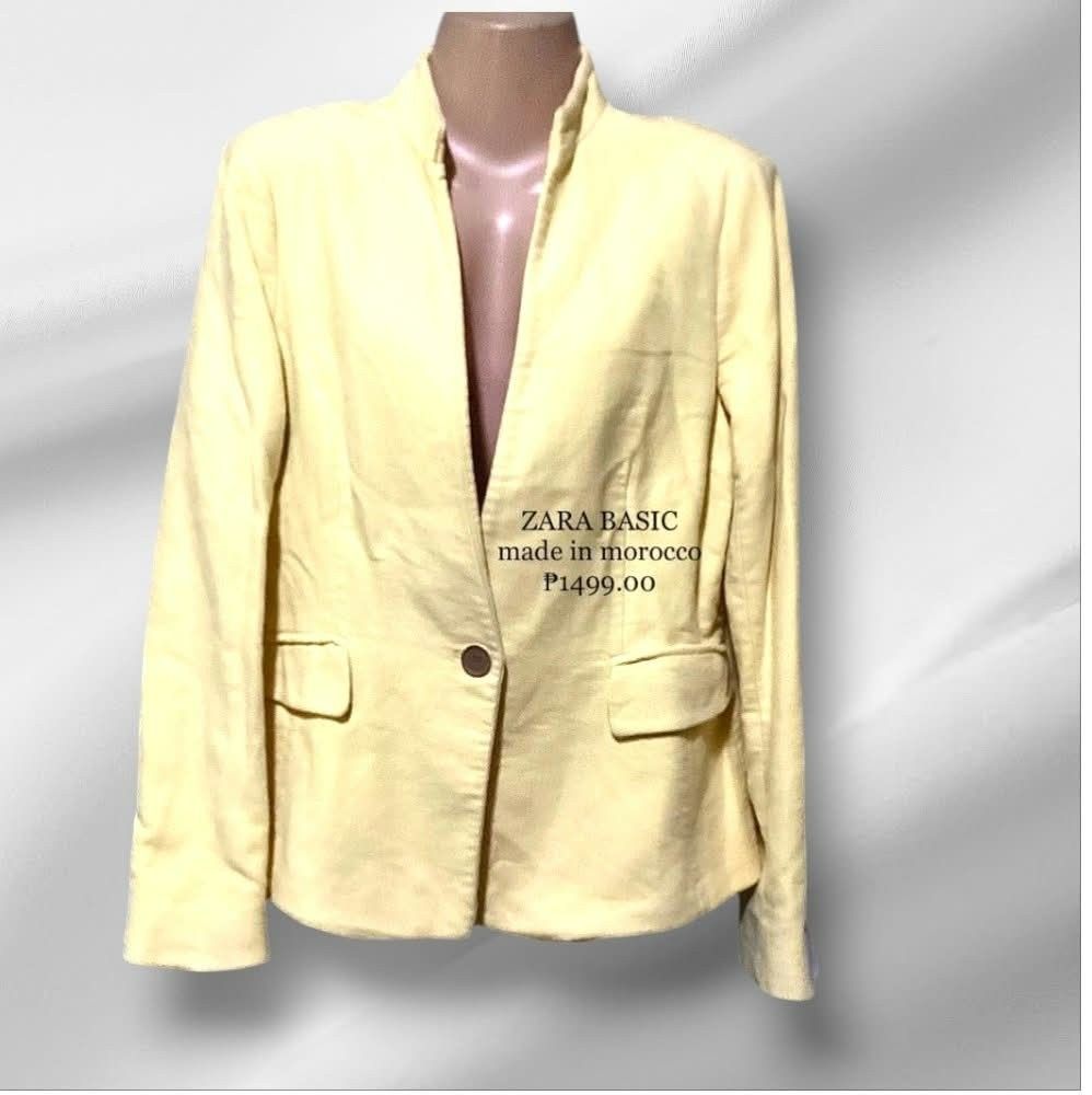 Zara Basic Yellow Blazer Jacket (Category: Coats, Jackets and Outerwear) located in Paranaque City. Submitted by calm_youngstore7 (Listing ID 1469614517, Image 2). Description: - Brand: Zara Basic - Origin: Made in Morocco - Condition: Brand new with tag attached - Color: Light pastel yellow - Design: Structured collarless neckline with single button closure - Details: Front flap pockets and stylish button cuffs.