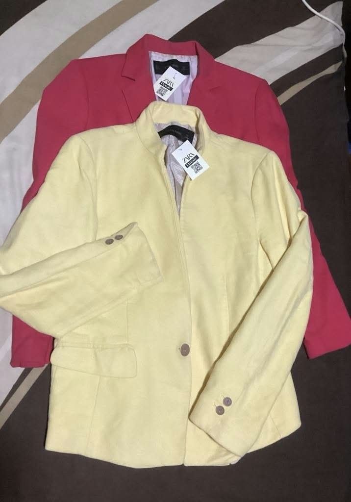 Zara Basic Yellow Blazer Jacket (Category: Coats, Jackets and Outerwear) located in Paranaque City. Submitted by calm_youngstore7 (Listing ID 1469614517, Image 3). Description: - Brand: Zara Basic - Origin: Made in Morocco - Condition: Brand new with tag attached - Color: Light pastel yellow - Design: Structured collarless neckline with single button closure - Details: Front flap pockets and stylish button cuffs.