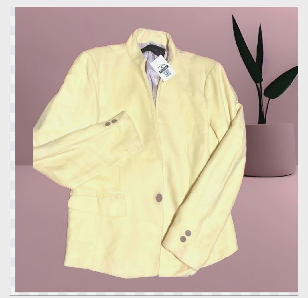Zara Basic Yellow Blazer Jacket (Category: Coats, Jackets and Outerwear) located in Paranaque City. Submitted by calm_youngstore7 (Listing ID 1469614517, Image 1). Description: - Brand: Zara Basic - Origin: Made in Morocco - Condition: Brand new with tag attached - Color: Light pastel yellow - Design: Structured collarless neckline with single button closure - Details: Front flap pockets and stylish button cuffs.