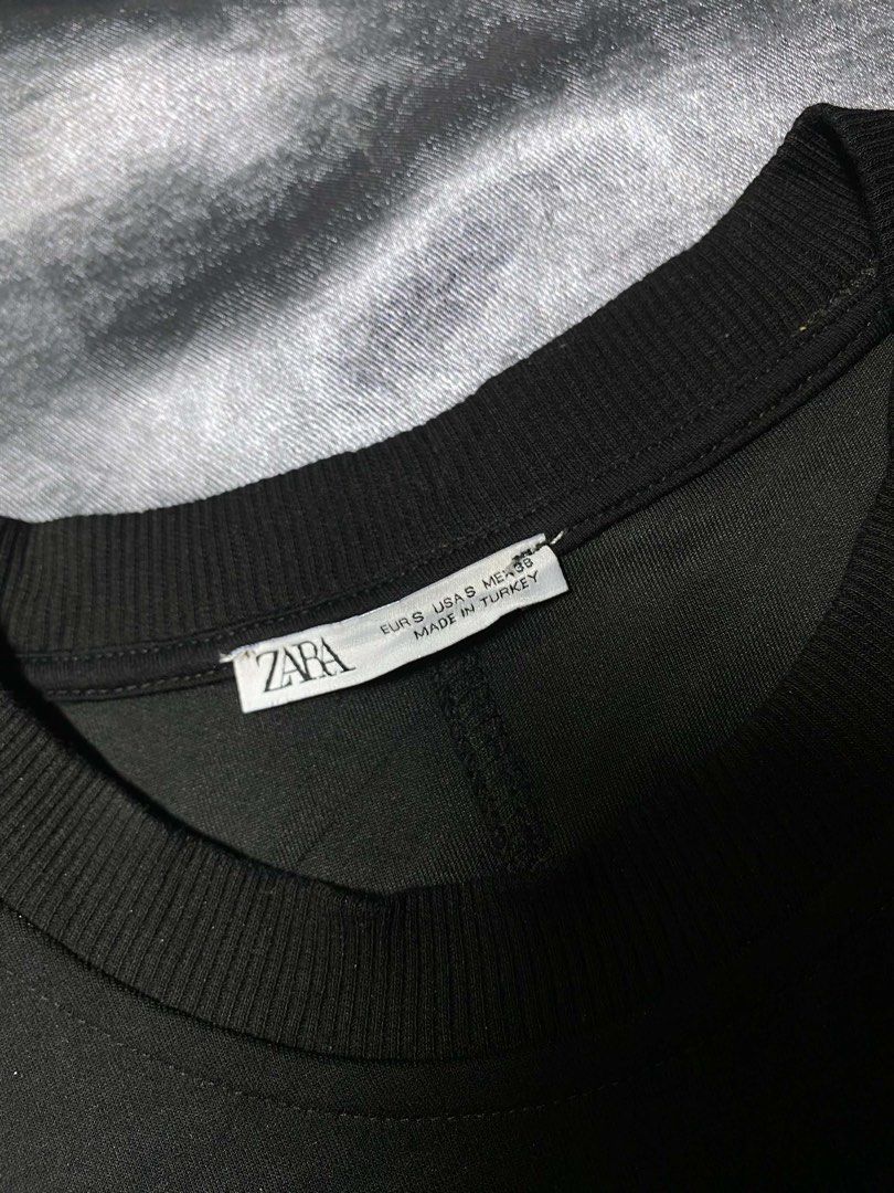 Zara Black Crewneck Sweatshirt Size S (Category: Longsleeves) located in Cavite. Submitted by bellewii (Listing ID 1469680942, Image 2). Description: - Brand: Zara - Size: EUR S / US S / MEX 38 - Color: Solid black - Material/Origin: Made in Turkey - Design: Clean minimal aesthetic with dropped shoulders - Details: Ribbed cuffs and hem with a small utility-style woven label patch near the bottom - Condition: Excellent basic piece that goes with e