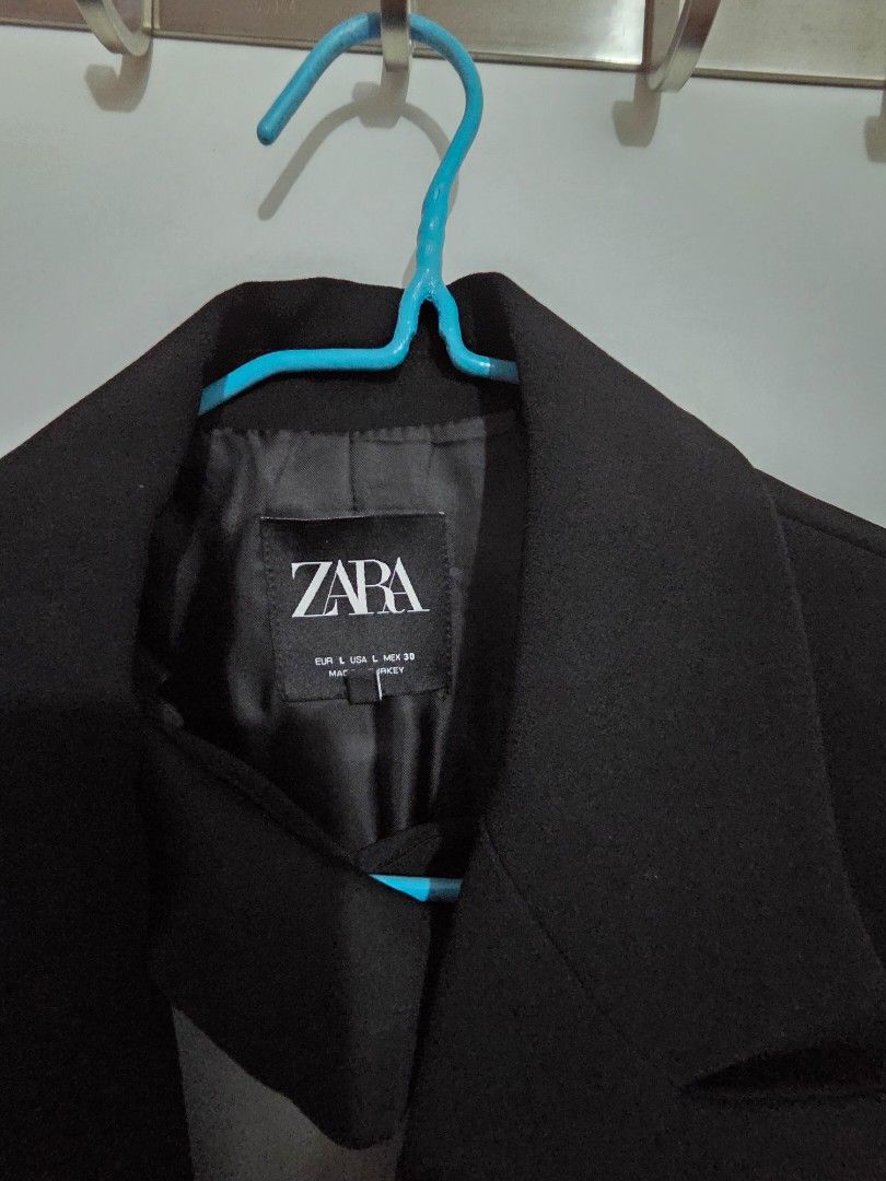 ZARA Black Double Breasted Blazer Size L (Category: Coats, Jackets and Outerwear) located in Mandaluyong City. Submitted by artlin04 (Listing ID 1469614723, Image 2). Description: - Brand: Zara - Style: Black double-breasted blazer - Size: L (true to standard sizing) - Details: Structured shoulders, lapel collar, front button closure, fully lined interior - Condition/Care: Clean solid color, holds shape well, standard garment care label attached 