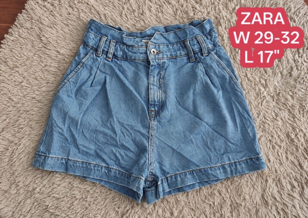 Zara Denim Paperbag Shorts (Category: Shorts) located in San Carlos City. Submitted by chinx008 (Listing ID 1469636469, Image 1). Description: - Brand: Zara - Style: High waist denim shorts with pleated front and contrast stitching - Color: Medium blue (light wash) - Features: Elastic waistband, front button closure, and deep pockets - Origin: Made in Turkey - Measurements: Waist 29" to 32", Length 17" - Condition: Clean and well-maintained.