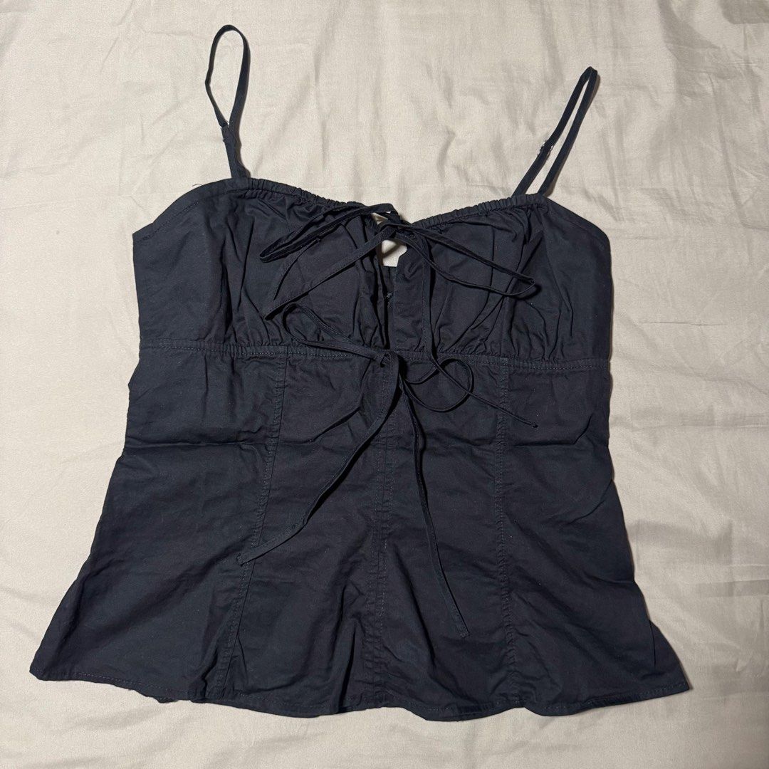 Zara Front Tie Strap Top (Category: Sleeveless) located in Manila. Submitted by nicoleaure20 (Listing ID 1469744039, Image 1). Description: - large on tag - in very good condition! just needs ironing :) - location: sampaloc, manila - mop: gcash/bpi - can be shipped thru lalamove/grab/ toktok/j&t but the buyer should shoulder the fee :) .
