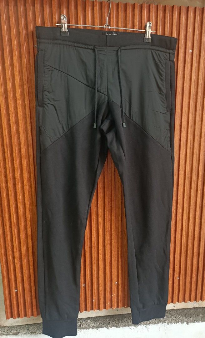Zara Man Black Joggers Sweatpants (Category: Joggers) located in Bayombong. Submitted by rheaaa00530 (Listing ID 1469685099, Image 1). Description: - Brand/Model: Zara Man Joggers - Size: Medium (true to size) - Color: Black - Material: Soft cotton-blend fleece - Features: Adjustable drawstring waistband, stylish contrast panel on the upper front, and ribbed ankle cuffs - Condition: Great for lounging or casual outings - Origin: Made in Banglades