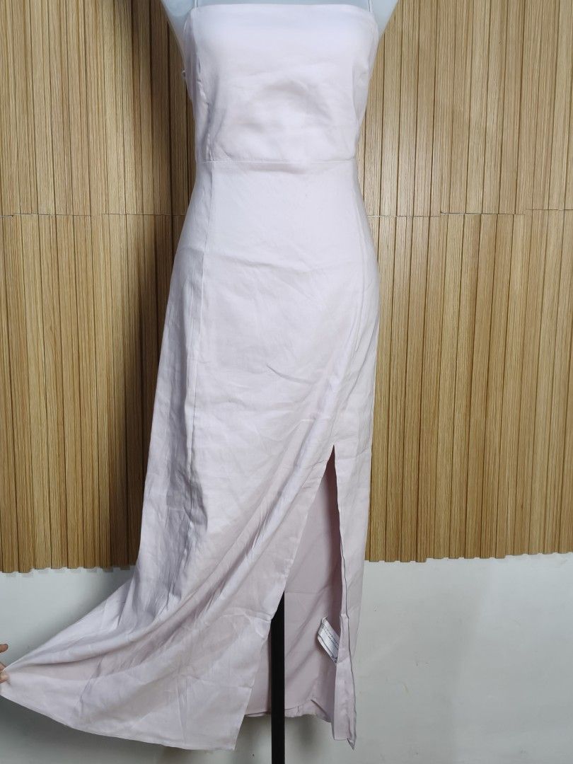 Zara Pink Midi Dress (Category: Dresses) located in Taguig. Submitted by ashie_clothing (Listing ID 1469686398, Image 3). Description: - Brand: Zara - Style: Midi dress with high front slit - Color: Soft pink - Details: Spaghetti straps, square neckline, open back with lace-up tie detail - Condition: Brand new with tags (BNWT) attached - Perfect for: Casual outings, dates, or special events.