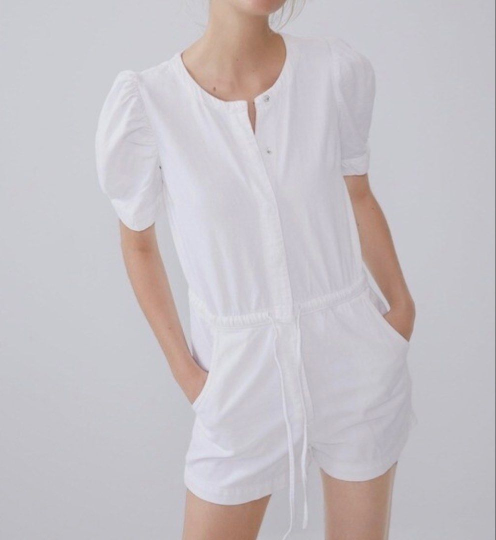 Zara White Puff Sleeve Romper Size S (Category: Rompers) located in Muntinlupa City. Submitted by henlo03 (Listing ID 1469610064, Image 1). Description: - Brand: Zara - Style: White romper - Size: S - Features: Short puff sleeves, round neckline, snap button front closure - Waist: Elasticized with adjustable drawstring detail - Pockets: Functional side pockets included - Origin: Made in Turkey - Condition: Clean, crisp white fabric, ready to wear