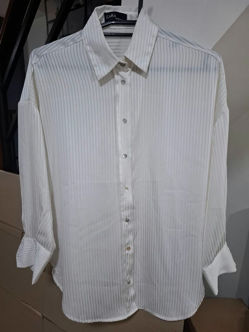 ZARA White Sheer Stripe Shirt (Category: Longsleeves) located in Pasig City. Submitted by dripcounty (Listing ID 1469685539, Image 1). Description: ZARA White Sheer Stripe Shirt ₱250 Bought in the Philippines Size: Unconfirmed — please confirm in chat Condition: Good / preloved White long sleeve button-front shirt with sheer stripe detail. Actual item shown in photos. Delivery fee shouldered by buyer (Lalamove / other courier). Item price exclude