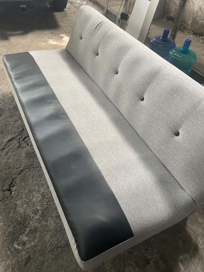 3 seater Sofa Bed (Category: Sofas) located in Makati City. Submitted by xaannee (Listing ID 1469781063, Image 2). Description: 3- seater Gray Sofa Bed Convertible With leather strip accent Dimensions: Length 165cm Width 94cm Height 34cm No issue Rfs: change to couch Pick up at makati.