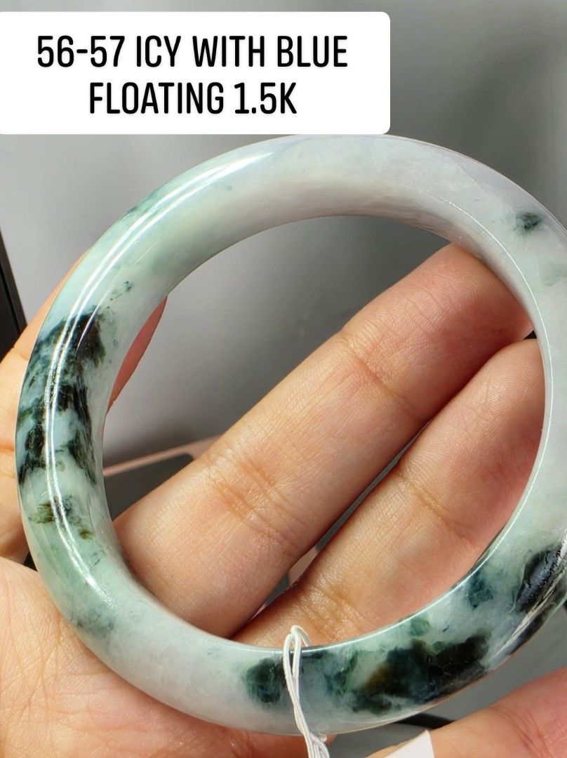 56-57 Icy Blue Floating Jade Bangle (Category: Bracelets) located in Manila. Submitted by jadeitesph (Listing ID 1469796219, Image 2). Description: - Stunning icy jade bangle featuring unique blue floating colors and rich dark green patches - Size: 56 to 57 - Surface: Smoothly polished with a gorgeous natural jadeite texture - Price Reference: Tag attached showing 1.5K - Perfect for daily wear or as a thoughtful gift.