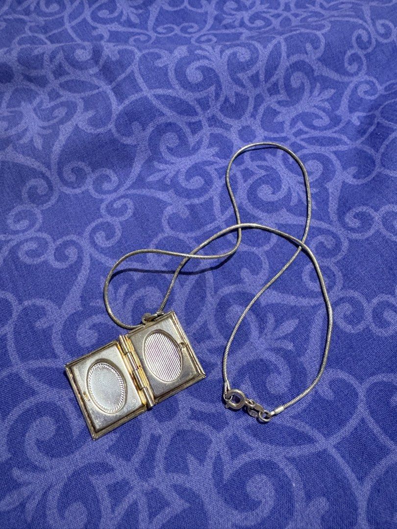 925 Sterling Silver Book Locket Necklace (Category: Necklaces) located in Quezon City. Submitted by meggys_treasures (Listing ID 1469918214, Image 3). Description: Note: This was given to me as a gift several years ago. Original packing is already missing. Hence, I cannot guarantee authenticity of the brand and of the silver content. - Size 16 - w/ TC brand markings, pls chat for more pics - with 925 markings - Never worn. Just kept as collection