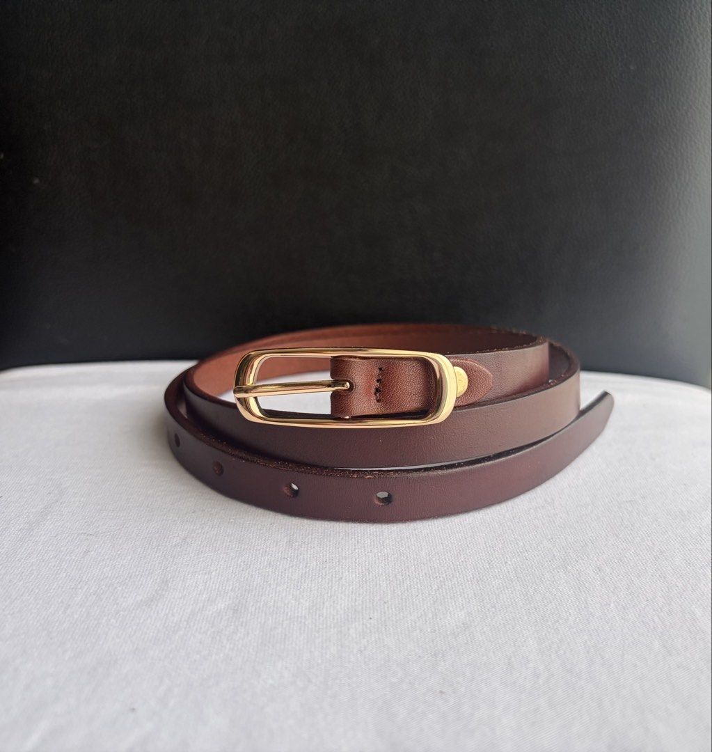 9. Slim Brown Leather Belt 2 (Category: Belts) located in Quezon City. Submitted by wagwagan_ukay_blues (Listing ID 1469854244, Image 1). Description: From Japan In good condition Please expect signs of usage Hole Size-26”-33” Overall-37” Width-.5” Novaliches Qc.