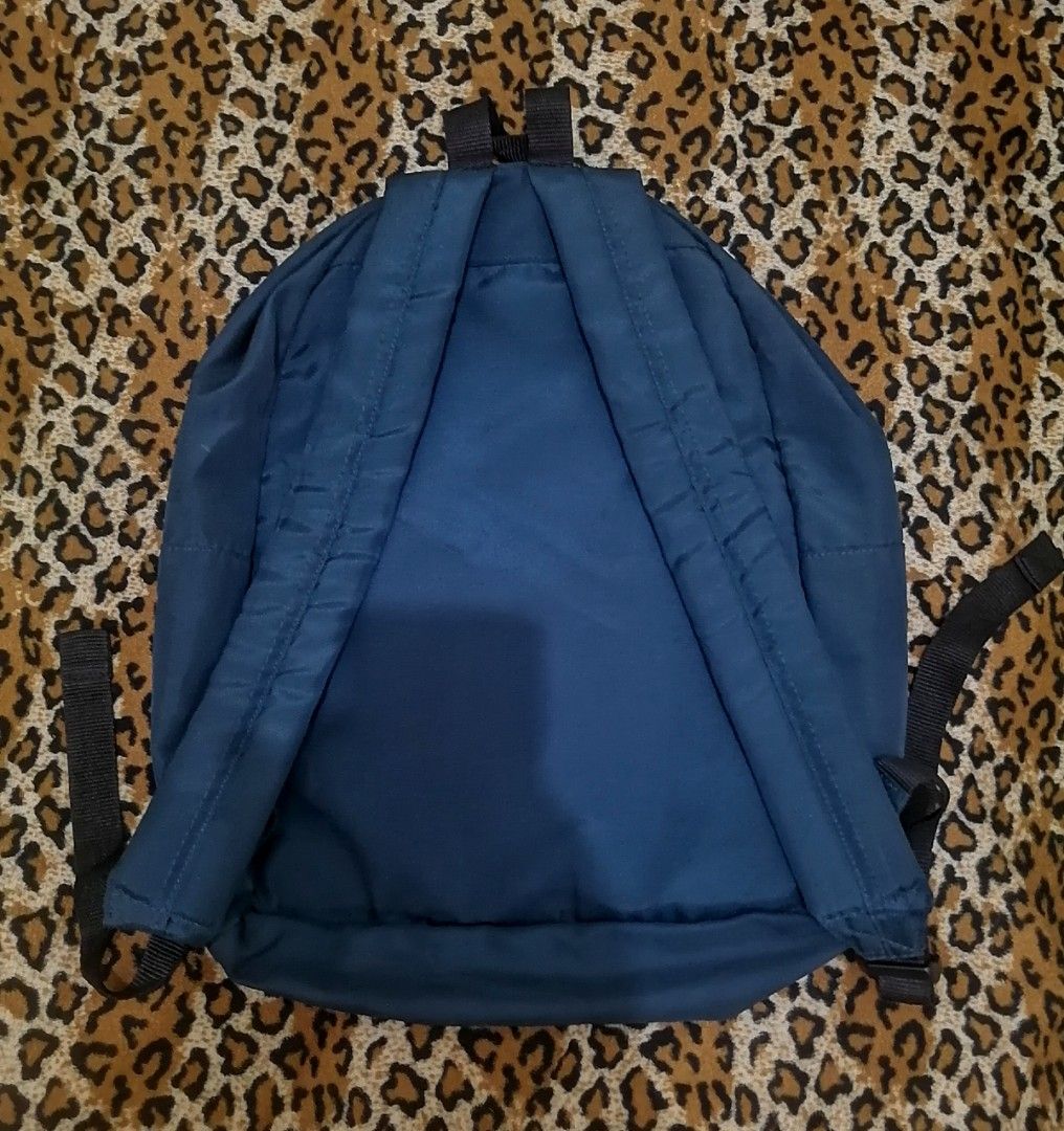 A Bathing Ape BAPE Navy Blue Backpack (Category: Backpacks) located in Cebu City. Submitted by roadthrift (Listing ID 1469937796, Image 2). Description: - Authentic dark blue BAPE backpack with large white ape head logo - Features a secure main compartment and convenient front zipped pocket - Comfortable, adjustable black shoulder straps for daily use - Crafted from durable 100% polyester (A Bathing Ape Nowhere Co., Made in China) - Condition: Ex