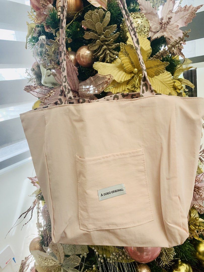A Gogo Original Reversible Pink Leopard Tote Bag (Category: Tote Bags) located in Apalit. Submitted by shopforbrands1 (Listing ID 1469799668, Image 1). Description: - 2-in-1 reversible design: Soft pink on one side, bold leopard print on the other - Functional pink side features a convenient front pocket and A Gogo Original tag - Stylish and durable matching leopard print straps - Spacious size ideal for daily use, school, work, or running errand