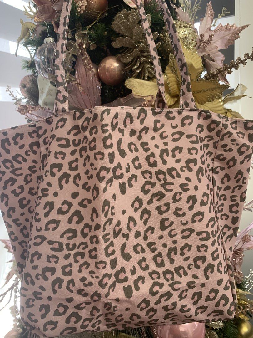 A Gogo Original Reversible Pink Leopard Tote Bag (Category: Tote Bags) located in Apalit. Submitted by shopforbrands1 (Listing ID 1469799668, Image 2). Description: - 2-in-1 reversible design: Soft pink on one side, bold leopard print on the other - Functional pink side features a convenient front pocket and A Gogo Original tag - Stylish and durable matching leopard print straps - Spacious size ideal for daily use, school, work, or running errand