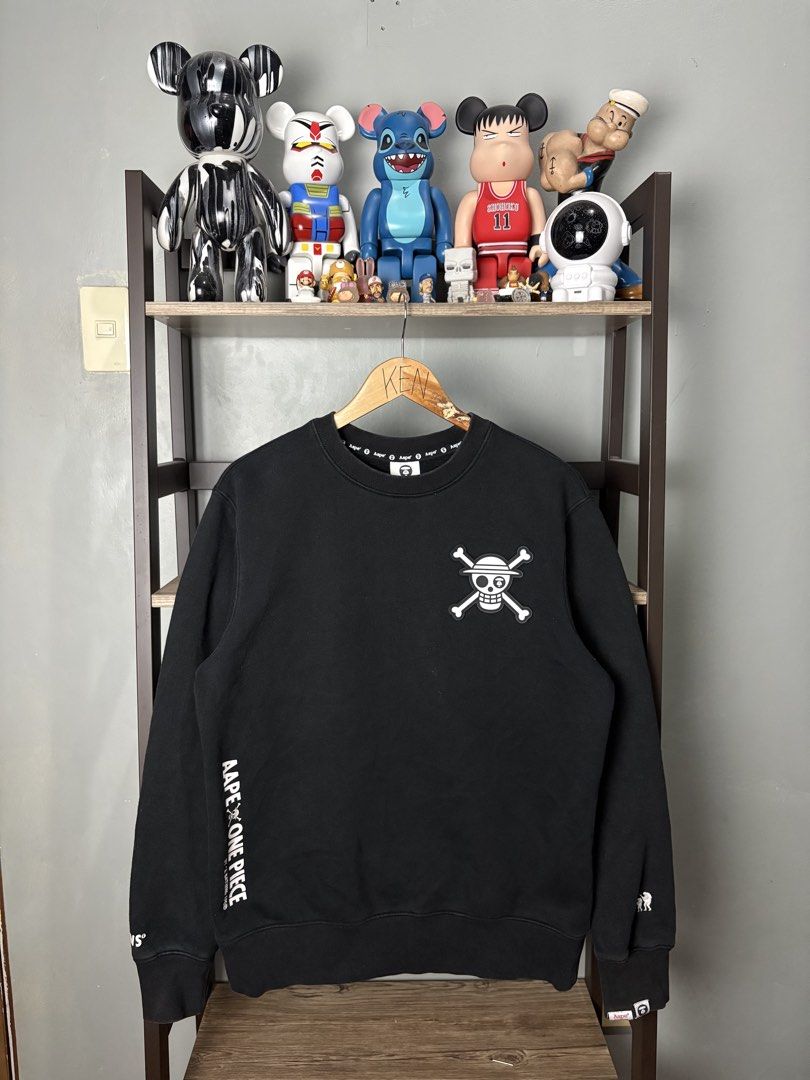 AAPE x One Piece Black Sweatshirt Size S (Category: Coats, Jackets and Outerwear) located in Manila. Submitted by thriftnikenv.2 (Listing ID 1469865280, Image 1). Description: - Brand: AAPE by A Bathing Ape x One Piece - Item: Black Crewneck Sweatshirt - Size: Small - Design: Luffy skull logo on chest, large graphic on back, branded sleeve and collar details - Material: Comfortable cotton and polyester blend - Condition: Brand new / Excellent - M