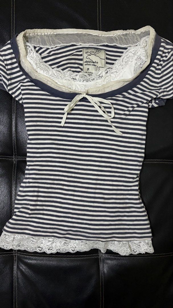 Abercrombie & Fitch (Category: Blouses) located in Manila. Submitted by runwayluster (Listing ID 1469895880, Image 1). Description: - Brand: Abercrombie & Fitch - Style: Y2K layered top with navy blue and white stripes Issue: small stain.