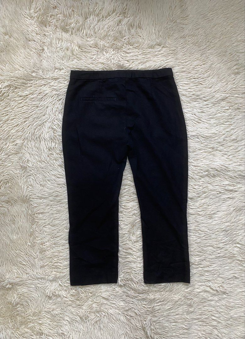 Acne Black Trousers Size 36 (Category: Other Bottoms) located in Antipolo. Submitted by switchneighborhood (Listing ID 1469819199, Image 3). Description: - Brand: Acne - Color: Solid black - Size: 36 - Design: Classic cropped length - Features: Clean waistband construction with rear pocket detail - Styling: Versatile piece for casual or smart outfits.