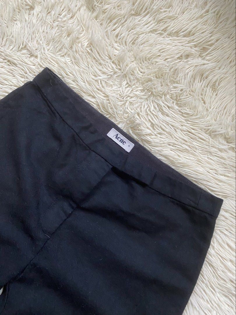 Acne Black Trousers Size 36 (Category: Other Bottoms) located in Antipolo. Submitted by switchneighborhood (Listing ID 1469819199, Image 2). Description: - Brand: Acne - Color: Solid black - Size: 36 - Design: Classic cropped length - Features: Clean waistband construction with rear pocket detail - Styling: Versatile piece for casual or smart outfits.