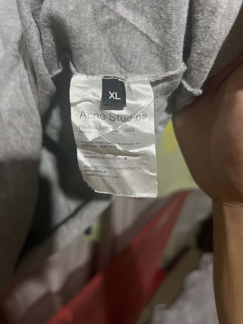 Acne Studios Grey Face Logo T-shirt (Category: Tshirts & Polo Shirts ) located in Koronadal. Submitted by daily_garment (Listing ID 1469889770, Image 3). Description: - Brand: Acne Studios - Color: Grey Heather - Size: XL (Casual Oversized Fit) - Material: 100% Cotton, Made in Portugal - Design: Classic face logo graphic on chest - Details: Standard crew neckline, short sleeves, with complete interior brand and wash tags (DIMENSIONS) WIDTH 21 LEN