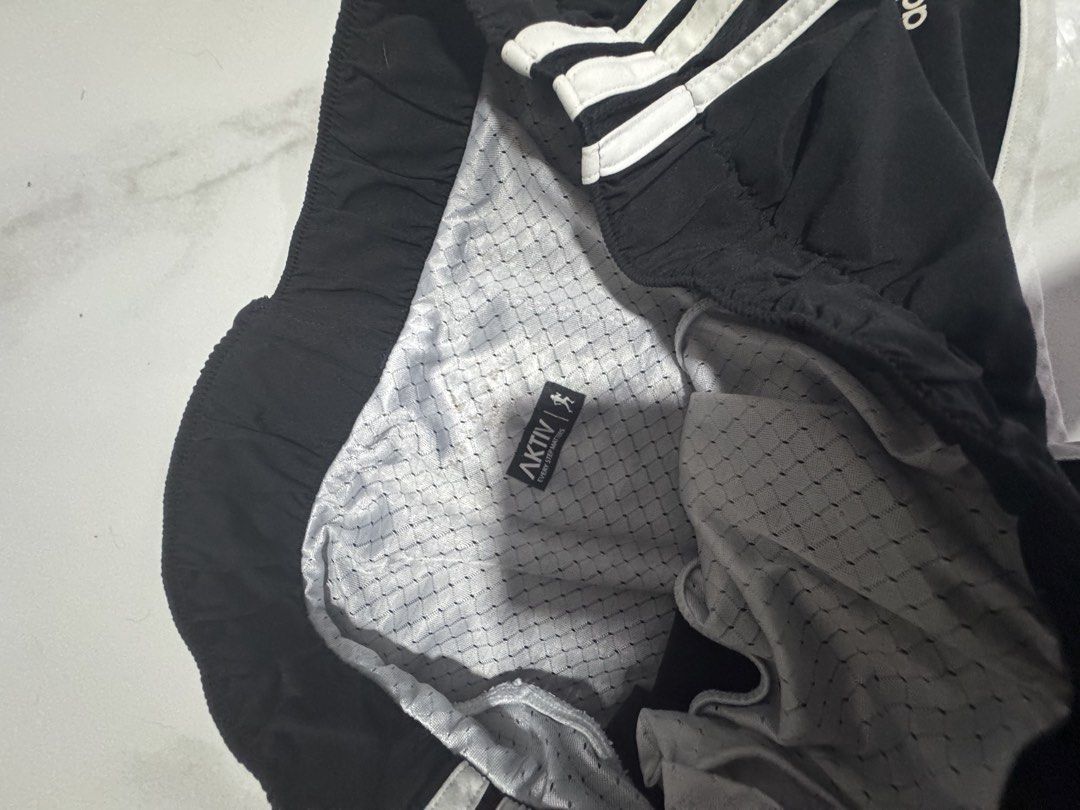 Adidas Black Athletic Shorts with White Stripes (Category: Shorts) located in Manila. Submitted by decluterthings888 (Listing ID 1469834248, Image 2). Description: - Classic black athletic shorts - Stylish white three-stripe detailing and contrast piping - Comfortable elastic waistband - Built-in white mesh lining with Aktiv branding tag - Great for gym workouts, running, or everyday casual use pickle ball ootd.