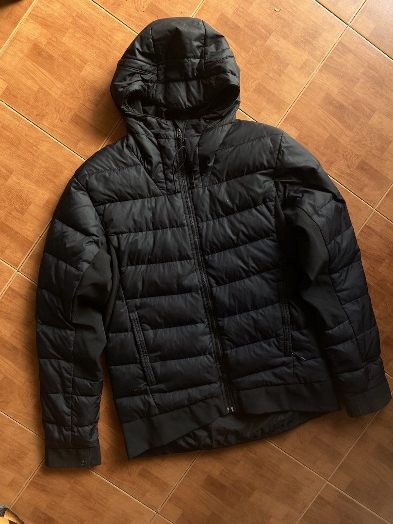 Adidas Black Puffer Jacket with Hood (Category: Coats, Jackets and Outerwear) located in Manila. Submitted by blu_stunne (Listing ID 1469804681, Image 3). Description: - Brand: Adidas - Color: Classic Black - Fit: Standard fit - Hood: Attached hood with adjustable drawstrings - Closure: Full zip front - Pockets: Two secure zippered front pockets - Design: Quilted body panels with smooth fabric on sleeves and sides - Details: Ribbed cuffs and hem 