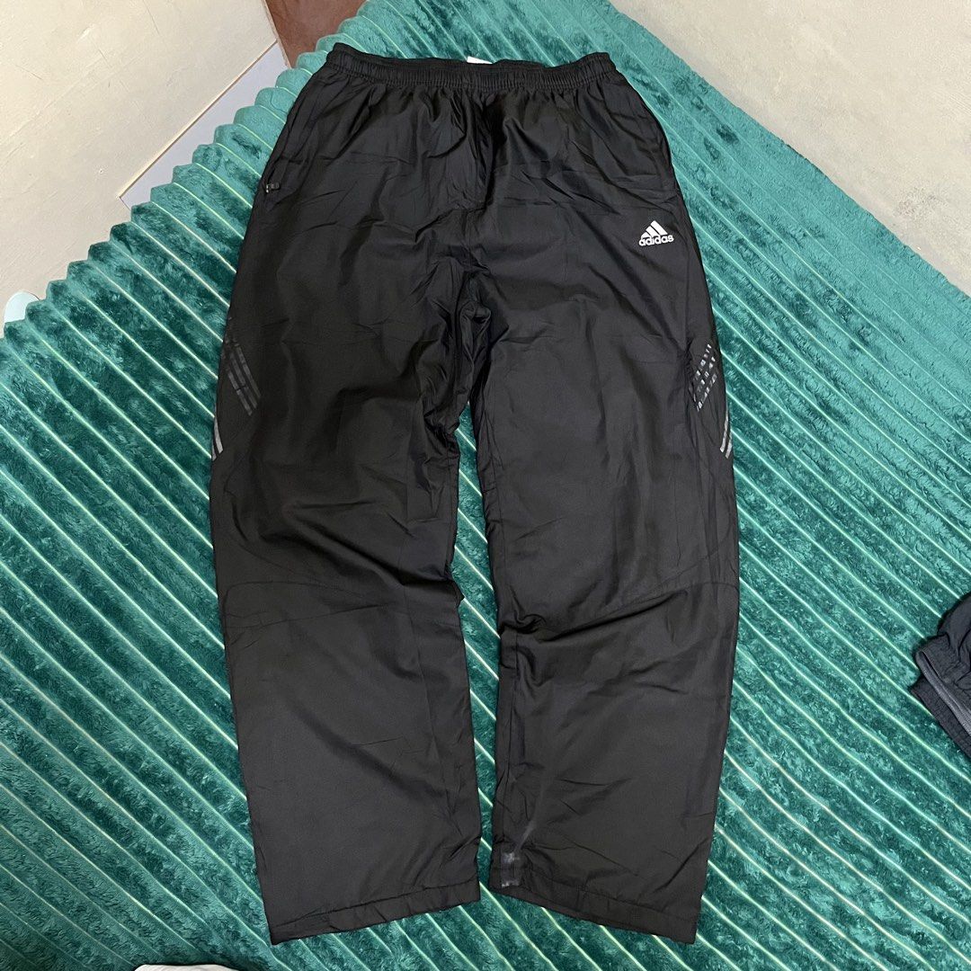 Adidas Black Track Pants (Category: Joggers) located in Manila. Submitted by thriftkolngeh (Listing ID 1469935015, Image 1). Description: - Brand: Adidas - Color: Black with silver logo and reflective three stripes - Size: Asian XXXL - Country of Origin: Made in Indonesia - Features: Elastic waistband with drawstring, cozy inner lining for extra warmth - Condition/Use: Great for workouts or casual streetwear pm sa ibang dets tinamad nko palitan e