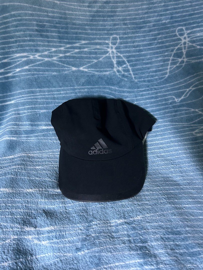 Adidas Climalite Black Cap OSFM (Category: Caps & Hats) located in Quezon City. Submitted by thriftxgoods (Listing ID 1469895603, Image 1). Description: - Brand: Adidas Climalite - Color: Classic black with grey front logo - Size: One size fits most with adjustable strap - Material: 90% recycled polyester, 10% elastane - Features: Interior sweatband with repeated Adidas branding, moisture-wicking technology - Condition: Clean, great for running, 