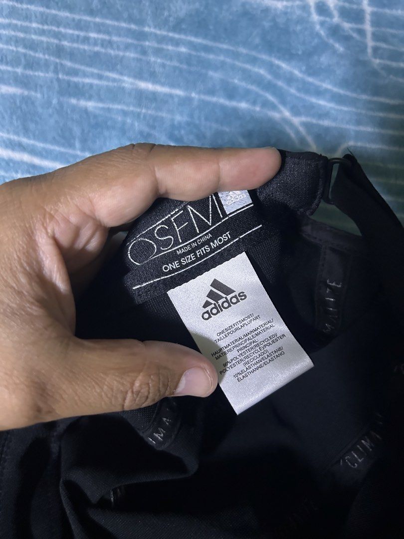 Adidas Climalite Black Cap OSFM (Category: Caps & Hats) located in Quezon City. Submitted by thriftxgoods (Listing ID 1469895603, Image 3). Description: - Brand: Adidas Climalite - Color: Classic black with grey front logo - Size: One size fits most with adjustable strap - Material: 90% recycled polyester, 10% elastane - Features: Interior sweatband with repeated Adidas branding, moisture-wicking technology - Condition: Clean, great for running, 