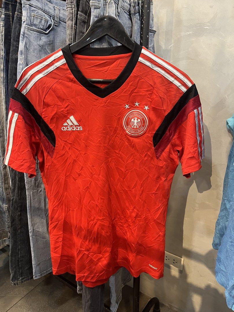 Adidas Germany DFB Training Jersey Red Size 100 (Category: Activewear) located in Manila. Submitted by cycy16_2004 (Listing ID 1469780213, Image 1). Description: - Authentic Adidas Germany DFB training jersey in striking red - Features Adizero technology for a lightweight, breathable fit - Short sleeves with a stylish black v-neck collar - Embroidered team crest and Adidas logo on the chest - Size 100: Best fits height around 178cm and chest 100c
