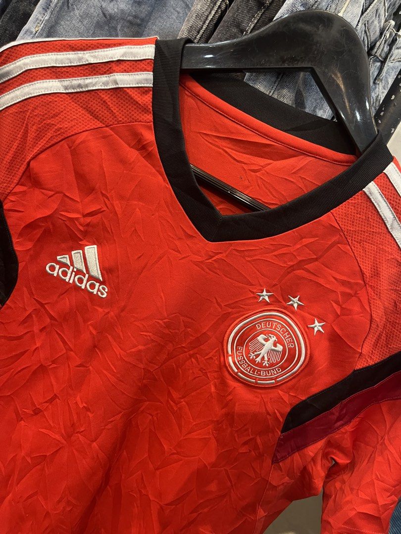 Adidas Germany DFB Training Jersey Red Size 100 (Category: Activewear) located in Manila. Submitted by cycy16_2004 (Listing ID 1469780213, Image 2). Description: - Authentic Adidas Germany DFB training jersey in striking red - Features Adizero technology for a lightweight, breathable fit - Short sleeves with a stylish black v-neck collar - Embroidered team crest and Adidas logo on the chest - Size 100: Best fits height around 178cm and chest 100c
