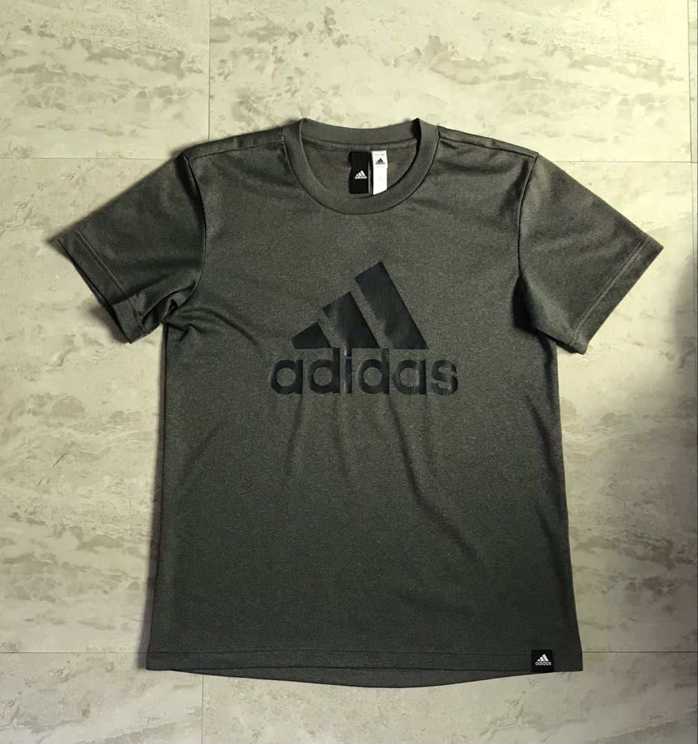 Adidas Grey Athletic T-Shirt Size L (Category: Tshirts & Polo Shirts ) located in Banga. Submitted by brighthorse.b8f582 (Listing ID 1469868077, Image 1). Description: - Brand: Adidas - Color: Grey with large black graphic logo - Size: L (Product Code: CX3282) - Material: 100% breathable polyester - Condition/Details: Short sleeves, crew neck, manufactured 01/18 - Best for: Gym workouts, running, or casual streetwear - PM for inquiries or fast sh