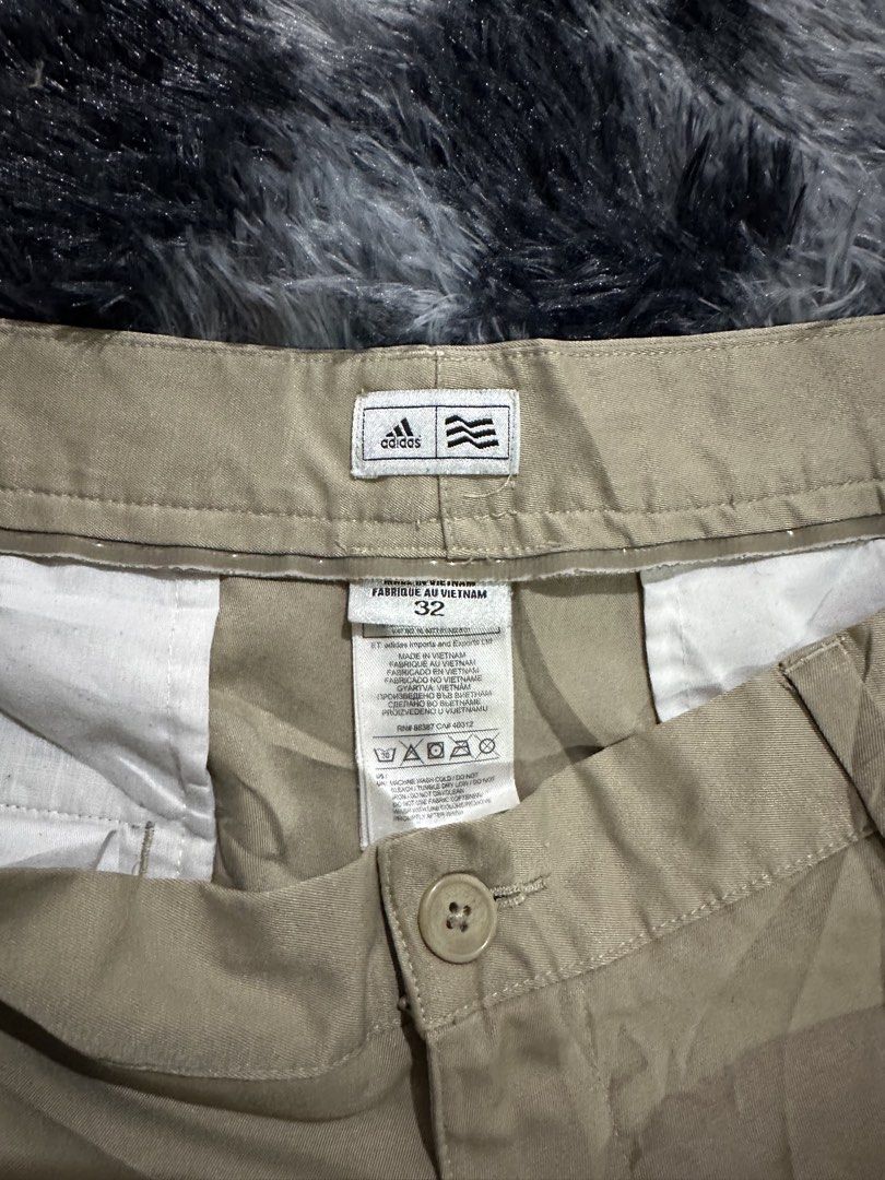 Adidas Khaki Shorts Size 32 (Category: Shorts) located in Iba. Submitted by thriftcoyan (Listing ID 1469885224, Image 2). Description: - Brand: Adidas - Color: Khaki - Size: 32 -Length 20 - Closure: Button and zip fly with belt loops - Pockets: Two front pockets and two buttoned back welt pockets - Details: Subtle embroidered Adidas logo on the back right pocket - Origin: Made in Vietnam with care tag intact.