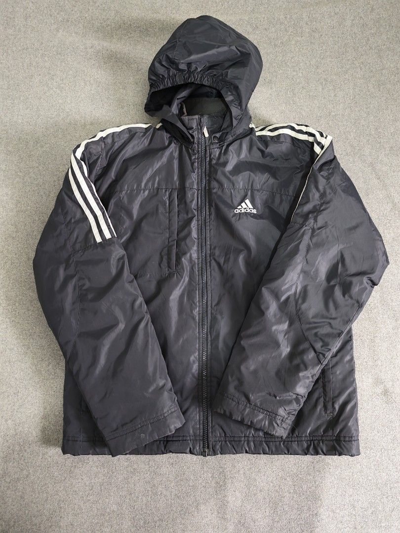 Adidas Winter Puffer Jacket (Category: Coats, Jackets and Outerwear) located in Manila. Submitted by goku_doggo (Listing ID 1469839925, Image 1). Description: - Authentic vintage 2003 Adidas padded jacket - Color: Classic Navy Blue with white three stripes on sleeves - Features: Full zip closure, high collar, and attached hood for maximum warmth - Storage: Secure side zippered pockets - Condition: Well-maintained, rare find from 2003 - Perfect fo