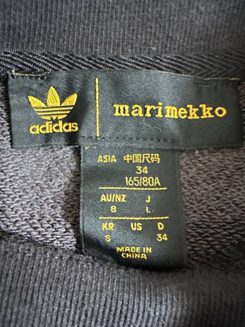 Adidas x Marimekko Unikko Crew Sweatshirt (AUTHENTIC) (Category: Coats, Jackets and Outerwear) located in Binmaley. Submitted by luiss.16 (Listing ID 1469842637, Image 3). Description: Adidas x Marimekko Unikko Crew Sweatshirt (AUTHENTIC) Size: S on tag Color rate: 9/10 Issue: None.