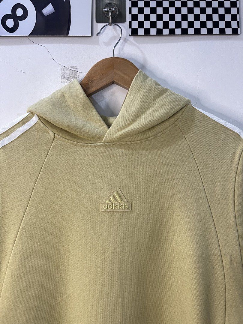 Adidas Yellow Hoodie Pullover Sweatshirt (Category: Coats, Jackets and Outerwear) located in Cabagan. Submitted by blessingma81004 (Listing ID 1469768268, Image 3). Description: - Brand: Adidas - Style: Pullover hoodie with front kangaroo pocket - Color: Yellow with white 3-stripe details on sleeves - Logo: Embroidered Adidas logo on chest - Size: Tagged 175/96A (Fits like XL) - Measurements: Width 25" | Length 28" - Origin: Made in China.
