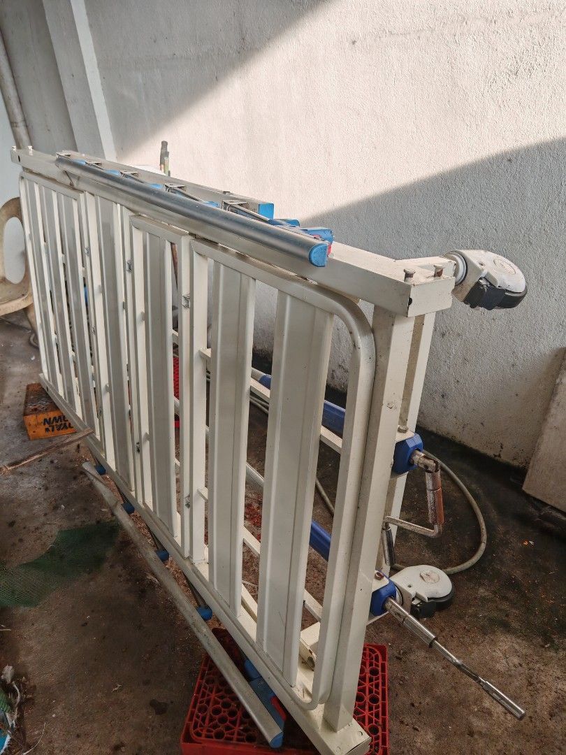 Adjustable Hospital Bed with Egg Foam and Side Rails (Category: Bed Frames & Mattresses) located in Imus. Submitted by czariri (Listing ID 1469774672, Image 2). Description: - Type: Adjustable hospital care bed with manual crank handles - Inclusions: Side safety rails, overbed table attachment, and extra yellow foam mattress cushion - Build: Sturdy metal frame with smooth-rolling wheels for easy mobility - Condition: Excellent for home patient ca