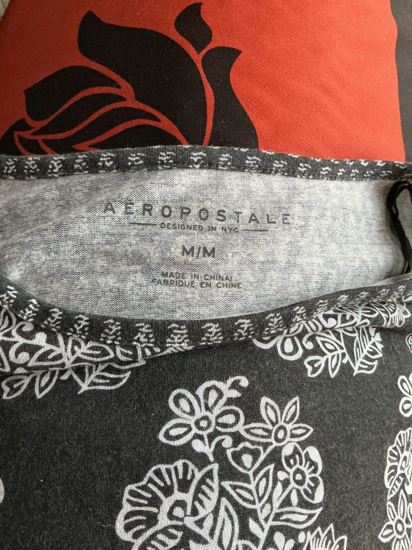Aeropostale Black Floral Border Tie Front Tee (Category: Blouses) located in Quezon City. Submitted by shopabilitymnl (Listing ID 1469826516, Image 3). Description: Size: small Mannequins’s Size: - Bust: 36-37 inches - Length: 23 inches.