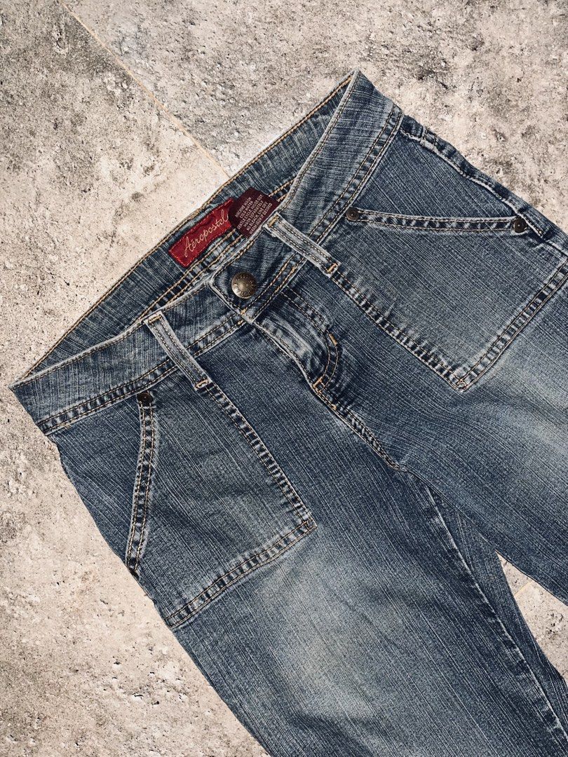Aeropostale Flare Jeans Size 0L (Category: Jeans) located in Dagupan City. Submitted by shanadongsb (Listing ID 1469864373, Image 2). Description: - Brand/Style: Aeropostale low-rise flare jeans - Wash/Color: Medium wash denim with contrast stitching - Size: 0L (Long) - Details: Front flap pockets and button-flap back pockets - Material: Cotton, polyester, and spandex blend - Condition: Slight distressing along the bottom hems from regular wear.