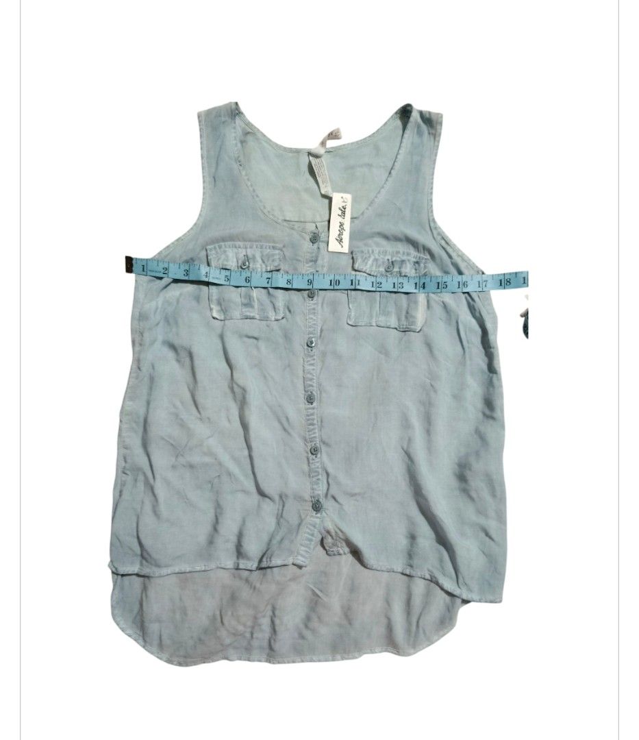 Aeropostale Light Blue Button-Front Tank Top (Category: Sleeveless) located in Paranaque City. Submitted by calm_youngstore7 (Listing ID 1469772201, Image 3). Description: - Brand: Aeropostale (Brand new with tags attached) - Color: Light blue - Style: Sleeveless top with front button placket and dual chest pockets - Hem: High-low curved hem design - Fabric: Lightweight and soft material - Measurements: ~18" pit-to-pit, ~28" back length.